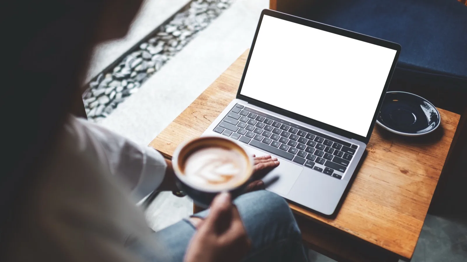 Agent reviewing a client list on a laptop