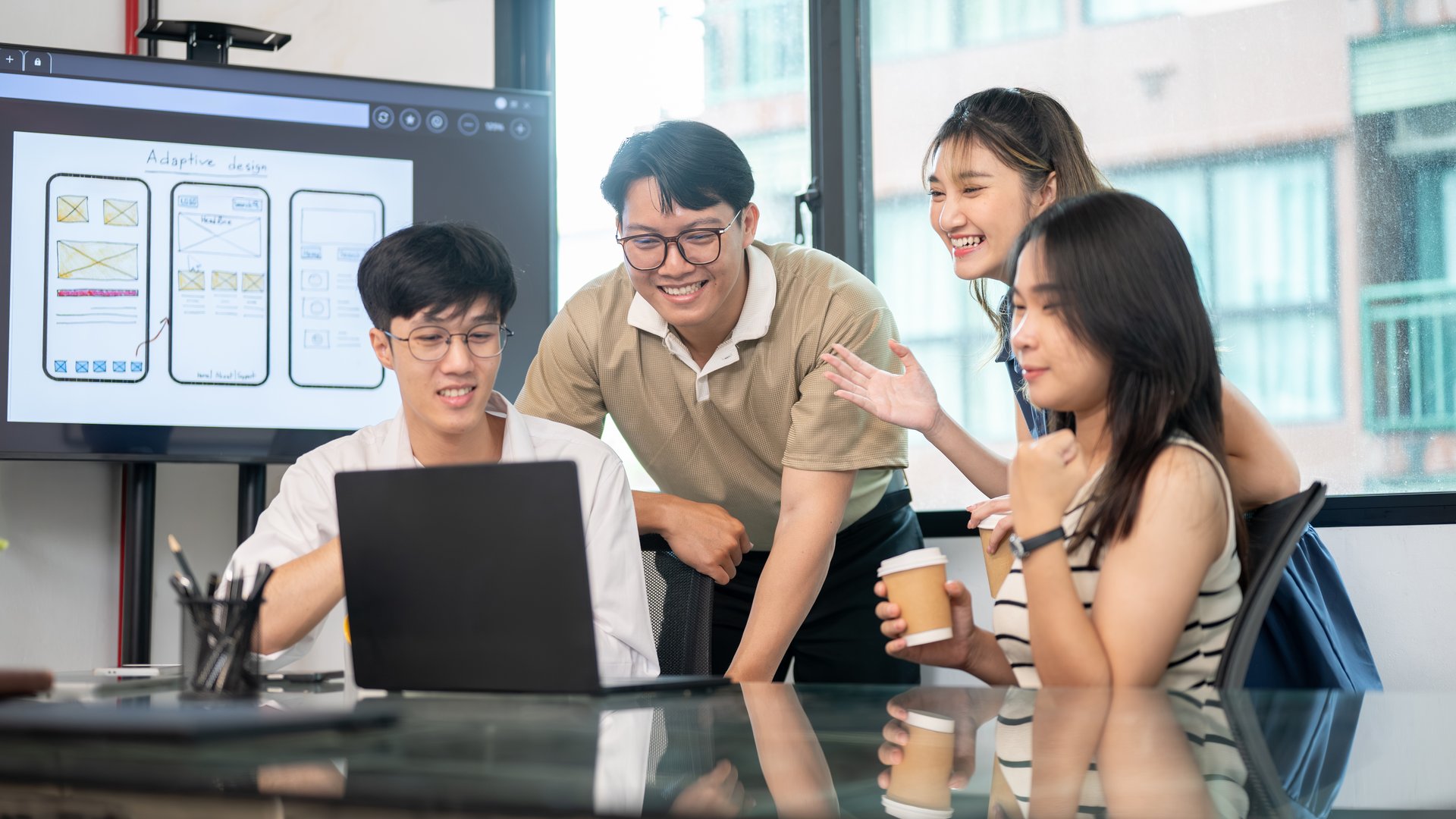 Sales team reviewing automated pipeline stages on a dashboard